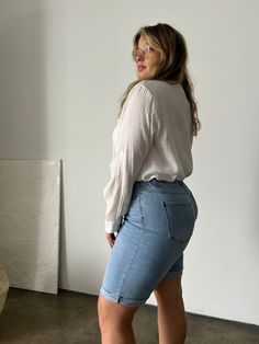 Comfortable and modest, the Plus Size Cuffed Bermuda Denim Shorts are easy to throw on with a t-shirt or blouse for a casual outfit. Grab your favorite sneakers and a cute tote and you'll be ready to head to the beach or run some errands. These shorts feature cuffed bottom hems that are sewn in place, five functional pockets and 5 belt loops, a zipper fly, and a single button closure. The material is a very stretchy denim. These shorts are made from 88% cotton, 8% polyester, and 4% spandex. Mach Short Length Denim Tops For Everyday, Everyday Short Length Denim Tops, Casual Relaxed Fit Jean Shorts With Rolled Hem, Casual Denim Blue Jean Shorts For Spring, Relaxed Fit Jean Shorts With Rolled Hem For Spring, Casual Medium Wash Rolled Hem Jean Shorts, Casual Jean Shorts With Frayed Hem For Day Out, Casual Cotton Jean Shorts With Rolled Hem, Casual Medium Wash Shorts For Everyday