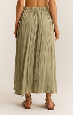 You're going to fall in love with this flowy midi skirt. The elastic waistband makes it so easy to wear and the crinkle fabric adds a slight sheen that sets it apart. Bohemian Style Lined Midi Skirt, Summer Rayon Maxi Skirt With Elastic Waistband, Bohemian Midi Length Lined Skirt, Spring Maxi Skirt With Elastic Waistband, Flowy Midi Length Bottoms For Day Out, Flowy Maxi Skirt With Elastic Waistband For Day Out, Spring Relaxed Maxi Skirt, Flowy Rayon Midi Skirt, Rayon Pleated Flared Skirt