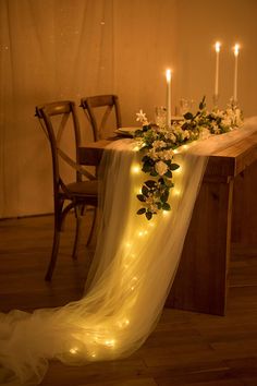 the table is decorated with candles and flowers