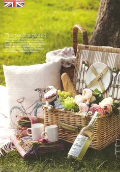 the picnic basket is full of food and drinks, along with other things to eat