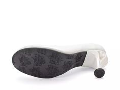 the sole of a white shoe with black and white accents on it, against a white background