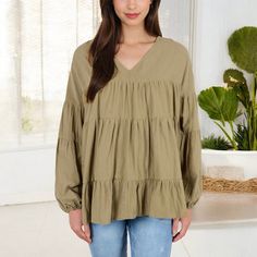 Embrace effortless style with the Anna-Kaci Women's V-Neck Tiered Babydoll Top. This top features a flattering V-neckline and a relaxed, tiered babydoll silhouette that adds a touch of bohemian flair to your look. The long puff sleeves with elastic cuffs provide a romantic touch, making this top perfect for both casual days and dressier occasions. Pair it with your favorite jeans or leggings for a chic, comfortable outfit that stands out in any setting. Comfortable Outfit, Satin Shirt, Babydoll Top, Long Puff Sleeves, Boyfriend Fit, Linen Women, Comfortable Outfits, Shop Blouses, A Romantic