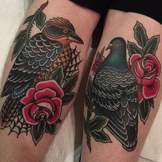 two birds with roses on their legs sitting next to each other