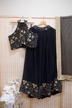 *Ready made 3 piece set  *Black & gold Floral Embroidered Halter Blouse, Flared skirt with matching border, and net dupatta  *Color may vary slightly from picture  *Our store is located in Los Angeles & in store pick up is welcome. Traditional Palazzo Set With Gold Embroidery For Festivals, Reception Palazzo Set With Gold Embroidery, Traditional Palazzo Set With Gold Embroidery For Eid, Traditional Gold Embroidery Palazzo Set For Festive, Traditional Gold Embroidery Palazzo Set For Festive Occasions, Traditional Palazzo Set With Gold Embroidery, Festival Chanderi Palazzo Set With Gold Embroidery, Festive Palazzo Set With Gold Embroidery For Eid, Traditional Designer Palazzo Set With Gold Embroidery