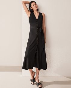 Elevate your wardrobe with the Ann Taylor V-Neck Button Flare Midi Dress, a timeless piece that exudes elegance and sophistication. Perfect for any warm-weather occasion, this dress features:

- Size: 0 (Regular fit)
- Color: Classic Black
- Material: 95% Polyester, 5% Spandex
- Gender: Women's
- Design: Sleeveless, V-neck with a button front
- Features: Self-tie belt, hits below the knee
- Length: 30" from natural waist
- Care: Machine washable

Crafted from a comfortable polyester-spandex blen Petite Midi Dress, Flare Midi Dress, Ann Taylor Petite, Sleeveless Dresses, Button Front Dress, Button Up Dress, Sleeveless Floral Dress, Photo Outfit, Petite Dresses