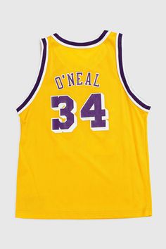 a yellow jersey with the number 34 on it and purple trimmings is shown