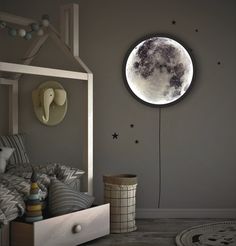 a room with a bed, night stand and an elephant clock on the wall above it