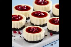 small desserts are arranged on a white tray