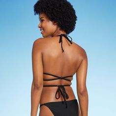 Triangle wrap bikini top from Wild Fable™ in black. Made from soft fabric with 4-way stretch and full lining for flexible comfort in and out of the water. Removable cups offer customizable coverage. Adjustable straps plus back and behind-neck ties provide the perfect stay-put fit. If you're not satisfied with any Target Owned Brand item, return it within one year with a receipt for an exchange or a refund. Wild Fable™: A look for every story. Black Halter Top With Tie Back For Pool, Black Tie-back Halter Top For Pool, Black Swimwear With Built-in Bra And 4-way Stretch, Black Strappy Swimwear With Tie Back, Black Tie-back Swimwear For Sunbathing, Black Halter Top With Tie Back For Beach Season, Fitted Swimwear With Crisscross Straps And Tie-side Bottom, Black Tie Back Halter Top For Beach Season, Black Tie-back Halter Top For Beach Season