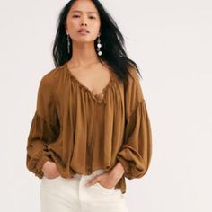 Free People Banda Blouse Nwt Size Small Ginger Snap New With Tag This Oversized, Boho Blouse Features A Front Tie Detail With A Flowy Silhouette, Exposed Seaming, & Ruched Hemlines. Exaggerated Sleeves With Pleating Throughout The Top. The Color Is Similar To Toasted Chestnut. If You Have A Short Torso The Length Will Not Be Cropped For You. Short Length Front & Back. Color Lighter Than Stock Pic. Exposed Seaming Drapey Silhouette Body Length Approx 23” Sleeve Length Approx 28” Beige Long Sleeve Tops With Blouson Sleeves, Chic Beige Tops With Blouson Sleeves, Neutral V-neck Blouse For Fall, Neutral Tops For Daywear In Fall, Neutral Tops For Fall Daywear, Neutral Fall Tops For Daywear, Beige V-neck Blouse With Relaxed Fit, Beige V-neck Blouse For Fall, Brown V-neck Top For Brunch