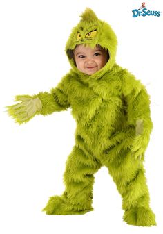 a little boy dressed in a grin costume