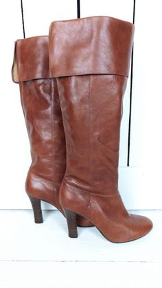 "90s brown tall cuffed high heel leather boots/rounded toe boots/9 Measurements... - marked size: USA 9 B -width at ball: 3\" -heel: 4\" -shaft height: 15.5\" -across top opening: 7\" Features... -genuine leather -cuffed top -round toe -Steve Madden Condition... -excellent leather condition -minor wear on soles 1G3011" Vintage Brown Knee-high Boots For Fall, Brown Wide Calf Heeled Boots With Round Toe, Fitted Brown Mid-calf Boots With Almond Toe, Retro Leather Heeled Boots With Wide Calf, Retro Wide Calf Leather Heeled Boots, Brown Wide Calf Mid-calf Boots With Almond Toe, Retro Brown Heeled Boots For Winter, Retro Knee-high Heeled Boots For Winter, Brown Medium Width Knee-high Boots