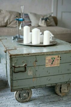 a coffee table with candles on top of it