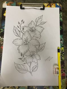 a drawing of some flowers on a piece of paper