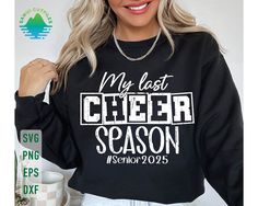 a woman wearing a black sweatshirt with the words my last cheer season printed on it