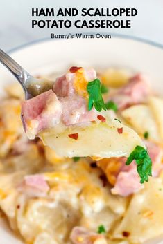 a close up of a spoon with food on it in a white bowl next to a fork