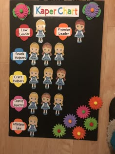 a bulletin board with flowers and stickers on it that says kaper chart,