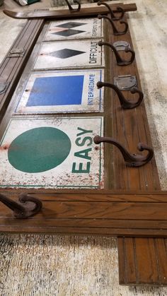 an old wooden frame with metal handles and letters on it