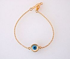 "Disc Mother of Pearl, Evil Eye Bracelet Silver, Gold Evil Eye Bracelets for Women, 925 Sterling Silver, Handmade Jewelry, Absolutely EYE catching! A beautiful round mother of pearl with an inlaid evil eye. I paired this one with a beautiful beaded curb chain. This beauty will keep bad spirits at bay, and good ones in your corner! Gold plated or silver color Enamel Evil Eye bracelet, Gold Evil Eye bracelet, 925 Silver sterling, Handmade Jewelry Your choice Sterling silver orchain. l *the chain a Handmade Gold Sterling Silver Bracelets, Sterling Silver Bracelet Ideal For Gifts, Sterling Silver Evil Eye Bracelet As Gift, Handmade Sterling Silver Evil Eye Bracelet, Sterling Silver Evil Eye Bracelet With Adjustable Chain, Elegant Handmade Sterling Silver Evil Eye Bracelet, Handmade Gold Sterling Silver Chain Bracelet, Adjustable Hallmarked Charm Bracelet As Gift, Gold Sterling Silver Evil Eye Bracelet