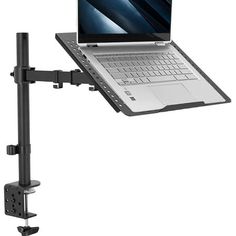 the laptop is mounted to the wall with a desk mount on it's arm