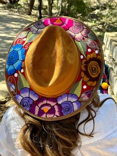 Check out our cozy and stylish Embroidered Sun Hat, perfect for adding a boho touch to your fall or winter wardrobe. This Women's Sun Hat, handcrafted in Oaxaca, Mexico, features a gorgeous hand embroidered floral design on the rim, bringing vibrant artesanias mexicanas right to your wardrobe. Made of a soft, felt-like material, it's a Felt Hat that not only keeps your head warm during the cooler months but also adds a splash of style with its unique sombrero mexicano charm. Whether you're enjoying a crisp autumn stroll or looking for that extra layer of warmth in winter, this hat has got you covered. Not your typical Winter Hat, this piece doubles as a statement accessory. With its fedora hat style, it's versatile enough to pair with your favorite boho outfits or add a unique touch to mor Fedora Hat Style, Wool Knit Scarf, Embroidered Sun, Woven Hat, Handcrafted Boots, Painted Hats, Crisp Autumn, Floral Hat, Hat Style