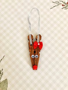 a wooden reindeer ornament hanging on a wall