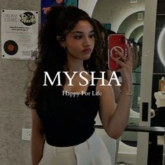 a woman taking a selfie in front of a mirror with the caption mysha happy for life