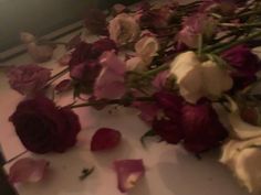 dried flowers are laying on the counter top