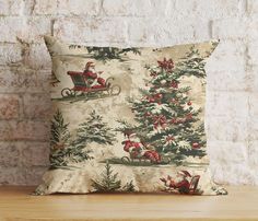 a decorative pillow with santa riding a sleigh