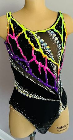 a female mannequin wearing a black leotard with neon colors on it