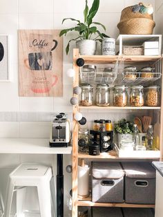 the shelves in this kitchen are filled with various items