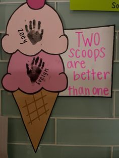 two scoops are better than one sign with handprints on ice cream cone