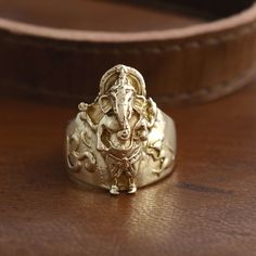 "Ganesh Brass Ring, Ganesha Ring, Golden Ring, Indian Ring, Spiritual Ring, Statement Ring, Hindu Ring, Elephant Ring, Men's Ring, Gift For Him Size:- All Size Available In Variation Metal:- Brass MUST READ....👇 5 stars is my shop's priority. So contact me before leaving any negative review. I am here only for my dear customers. it is poor Etsy manners to Leaving a negative review without conversation with your seller. If you are not satisfied with my jewelry, then please contact me, I will solve your problem. ❥ Customers' satisfaction is our biggest priority, please contact us with any questions/queries for future or existing orders, and we will do our best to make sure you are happy with your order. ❥ Please make sure to add the correct address during checkout. You can return your purch Rings With Intricate Design For Festivals, Spiritual Rings For Festivals Gift, Intricate Design Rings For Festivals Gift, Intricate Design Rings For Festivals And Gifts, Spiritual Rings As Festival Gifts, Festive Rings With Intricate Design As Gift, Festival Gift Rings With Intricate Design, Spiritual Wedding Rings For Festivals, Temple Jewelry Rings For Festivals And Gifts