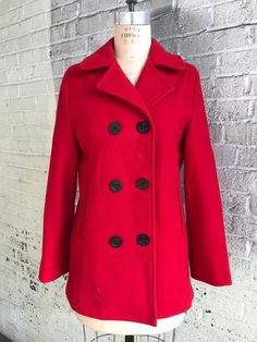 This 1980s Lands' End red peacoat is a classic. It is 100% virgin wool with a grey lining and marked a size 10. It is in great vintage condition with minimal signs of wear. The only flaws are a small moth hole in the wool on the left sleeve and two spots at the center back where a moth started nibbling (see photos). Red Peacoat, Small Moths, Wool Pea Coat, Wool Peacoat, Red Wool, Pea Coat, Lands End, Lady In Red, Jackets & Coats