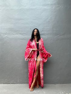 Bali Tie dyed Kimono long jacket, It's made by the Bali's traditional hand Tie dyed If you are very small this may be too big. Matching bag and belt are included Stylepark1 Model -Her height is 175Cm/5.74ft weight is 64kg/141.09Ib /American size, she wore ~ M to large size. Made from soft Rayon At first, you may smell the unique dye. It will disappear after you wash it. So do not worry. color - Bali Hand Tie-dyed Deep Pink red & multi A One size fits all (Very oversized) Model wore / A A - Lengt Long Festival Kimono With Natural Dye, Long Tie Dye Bohemian Kimono, Bohemian Long Tie Dye Kimono, Long Tie-dye Bohemian Kimono, Bohemian Long Tie-dye Kimono, Hand Tie, Oversized Bag, Long Kimono, Dyed Dress