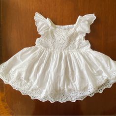 Gap Baby 12-18 Mos . White Eyelet Dress New With Tags . Sleeveless Cotton Baptism Dress For Spring, Cute Cotton Baptism Dress With Short Sleeves, Spring Dress From Gap For Dress-up Events, Cute Spring Baptism Dress, Cute Summer Baptism Dress, Cute Sleeveless Baptism Dress For First Birthday, White Gap Dress For Playtime, Cute Sleeveless Baptism Dress With Ruffles, Gap White Short Sleeve Dress