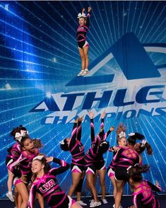 a group of cheerleaders performing on stage