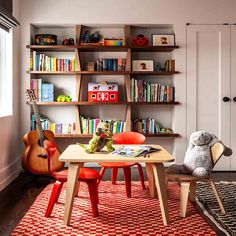 a child's room with bookshelves and toys