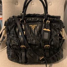 Authentic Prada. A Practical As Your Everyday Bag. Comes With Removable Name Tag, Adjustable Shoulder Strap And Dust Bag. Goldtone Hardware. In Great Condition. See Photos For All The Details. High-end Black Satchel For Errands, High-end Black Shoulder Bag For Errands, Luxury Black Shoulder Bag For Everyday Use, Luxury Black Shoulder Bag For Errands, Prada Bags, Leather Cross, Everyday Bag, Name Tag, The Details