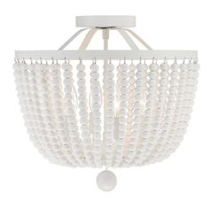 a white chandelier with beads hanging from the ceiling