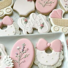 decorated cookies in the shape of baby items