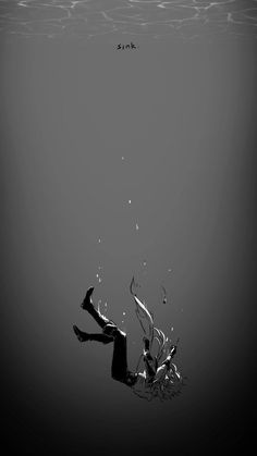 an underwater view of a person diving in the water