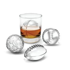 three different types of ice ball molds in front of a glass filled with liquid