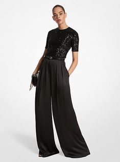 A masterclass in everyday sophistication, these palazzo pants are finely tailored in Italy from liquid-like satin and dyed in a versatile noir hue. The mid-rise silhouette features finely pressed creases that lend effortless movement with each step. Further accentuate the dramatic wide-leg cut with soaring high-heel sandals. Glamorous Luxury Pants For Date Night, Womens Cocktail Attire Pants Evening Party, Wide Leg Pants Dressy Outfit, Cocktail Outfit Pants Women, Black Trousers Outfit Dressy, Palazzo Pants Cocktail Outfit, Wide Leg Pants Outfit Party, Black Pants And Black Top Outfit, Glam Black Outfit