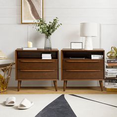 two wooden nightstands sitting next to each other on top of a white carpeted floor