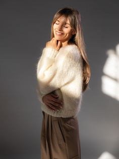 The precious mohair and organic wool blend together to create a simple, yet timeless sweater. Featuring an oversized fit and a boxy shape, it gives warmth and beauty with a hint of luxury. Made of voluminous, chunky yarn, with a slightly teddy bear texture. Each sweater is lovingly handmade, showcasing exceptional attention to detail, and a final piece just as unique as you are. This product is aligned with the best practices in Animal Welfare. Details Handcrafted• raspberry• flurry, voluminous mohair• extra softness and lightness• drop shoulders• composition: 59% mohair, 41% organic wool• cruelty free mohair, organic wool• the wool comes from sheep reared in biological farms and free from any mulesing treatment• premium Italian yarn, produced with a low environmental impact cycle• made in Mohair Jumpers, Cream Jumper, Woman Sweater, Handmade Knitwear, Fluffy Sweater, Camel Sweaters, Mohair Cardigan, Alpaca Sweater, Thick Sweaters