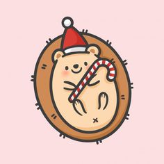 a cartoon bear wearing a santa hat and holding a candy cane in its mouth while sleeping