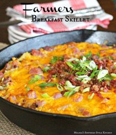 a skillet filled with food sitting on top of a table