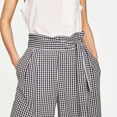 Zara Navy Blue/White Gingham Gouchos. Size Extra Small/Small. New Without Tags. Super Sweet But Note The Miniscule Tiny Color "Smidge" On The Left Bottom Pant. Due To The Gingham Pattern I Don't Believe It Can Be Observed At All And It May Come Out With Stain Remover (They Have Not Been Washed Or Tampered With.) Paper Bag Style Waist With Elasticized Back. Side Tie. Side Open Pockets. 12 1/2" Elasticized Waistband; 22" Inseam. 12 1/2" Flair. Classy, Comfortable And Super Sweet! Casual Gingham Pants For Summer, Gingham Cotton Pants, Gingham Bottoms With Pockets For Summer, Summer Gingham Bottoms With Pockets, Summer Bottoms With Pockets For Picnic, Chic Gingham Wide Leg Pants, Summer Picnic Bottoms With Pockets, High Waist Plaid Summer Pants, Summer Gingham Pants For Workwear