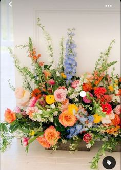 an arrangement of colorful flowers in a vase